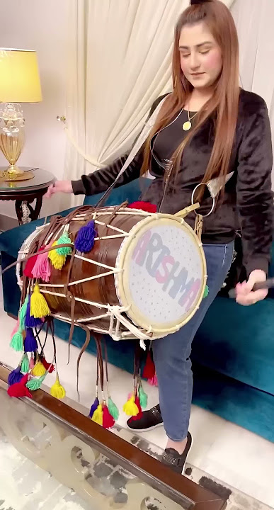 Arishma playing Dhol