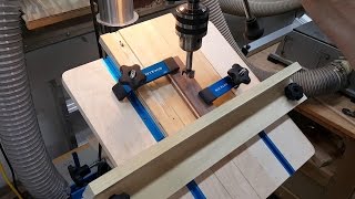 Build a drill press jig to hold stock at various angles. The fence attaches side to side or top to bottom. Two t-tracks provide for ample 