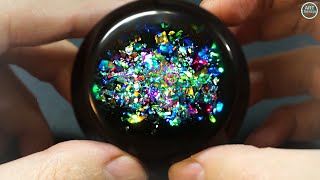 Opal made of epoxy resin. Resin art sphere. Epoxy resin. 3D Resin Art.