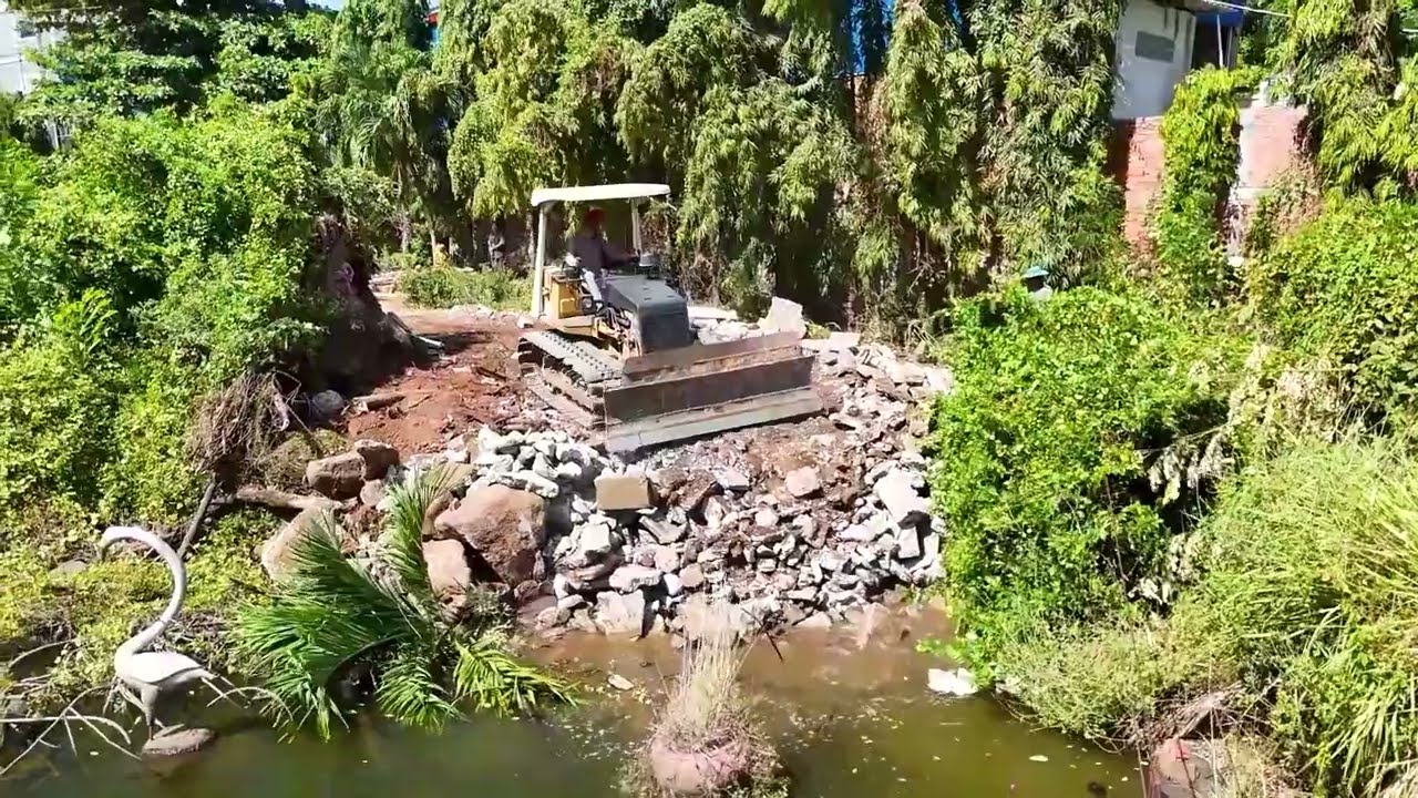 New Project Begins! Bulldozer Fills Abandoned Pond With Rocks for Land Development.