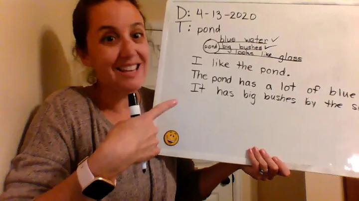 Mrs. Padgett showing how to do our writing.