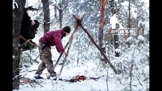 Owernight Bushcraft Camp Russia. Campfire, husky, axe.