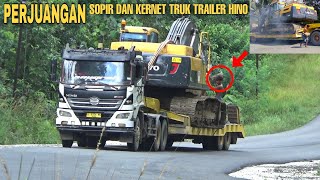 Perjuangan Sopir dan kernet Truk Trailer membawa muatan excavator
