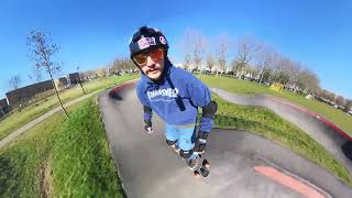 Solo longboarding sesh on a pumptrack