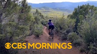 Woman starts mountain biking in her 50s, showing it's never too late: "New outlook on life"