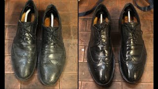 Cleaning and shine of old black shoes