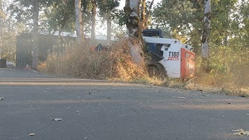 Flail Mower on Bobcat T180 Track Steer