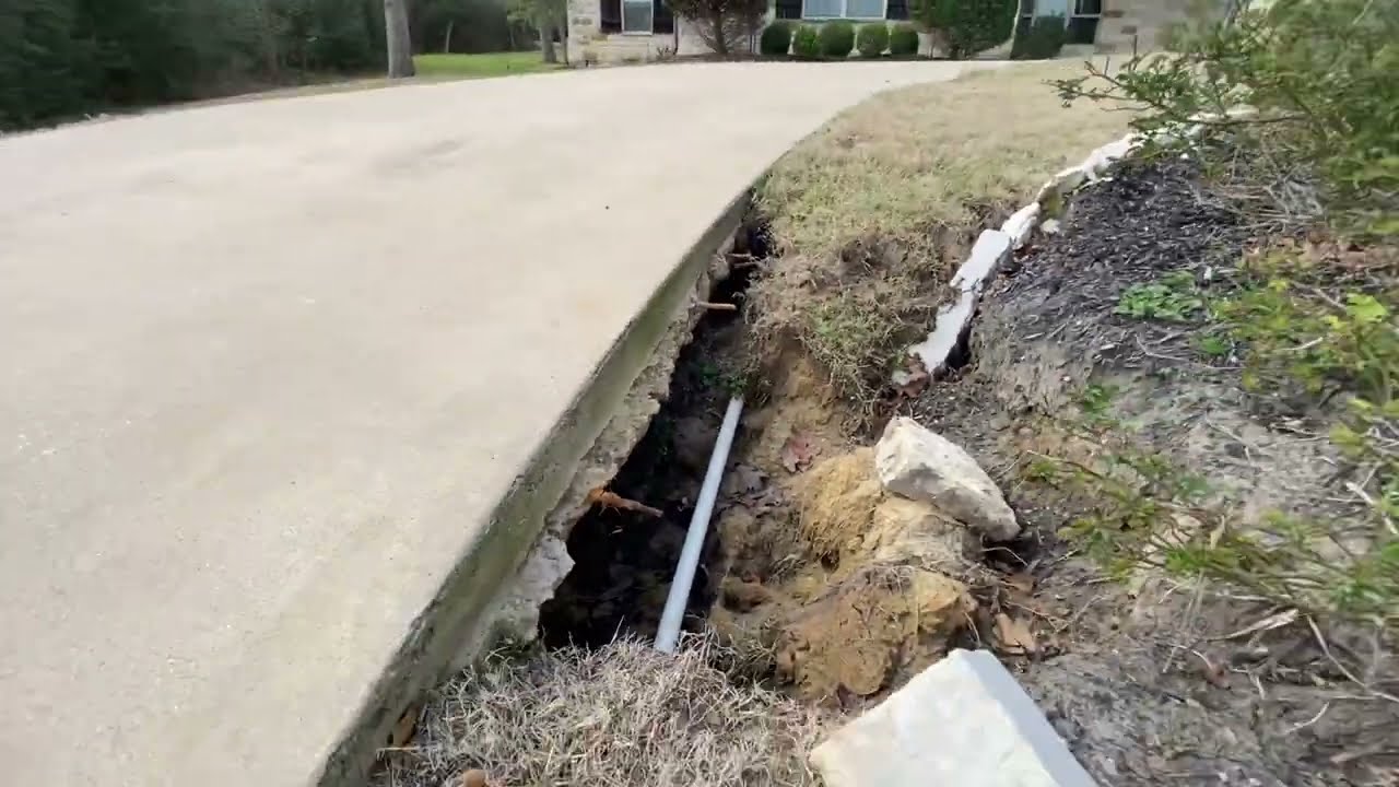 YIKES! What happens when you have erosion under your driveway and how to FIX IT.