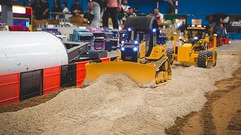 Watch These Tiny Trucks Build a Mini Road!
