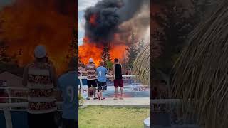 Crowds Watching a Fire as the Smoke Rises Fire at a Water Park
