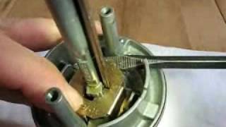 This video demonstrates how to remove the lock cylinder from a Kwikset SmartKey entry knob. The video starts with the knob 