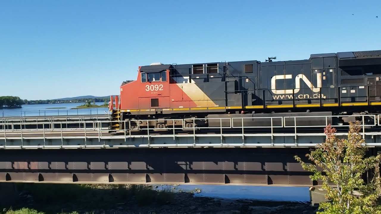 TRAINS CN Intermodal Meets Via Rail LRC on Dorion Rail Bridge YouTube