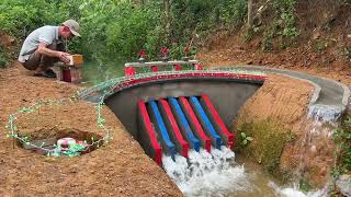 Blocking the flow of water to build a hydroelectric dam