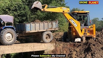 Village Road, JCB Backhoe Loader Loading Soil on Tractors