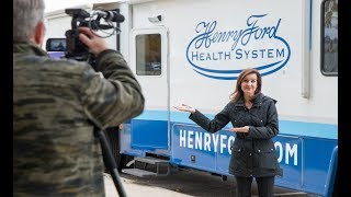 JoAnne Purtan from WOMC tours Henry, All of Us mobile unit