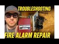 Troubleshooting a homes fire alarm system. 