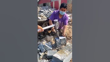 The process of splitting stones with an axe- Good tools and machinery make work easy