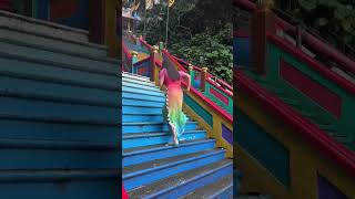 Running up the stairs at Batu Caves in Malaysia