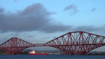 Cargo Ship Sailing Under Forth Railway Bridge Firth Of Forth Scotland
