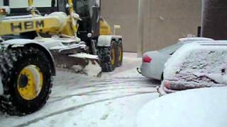 Snow removal with motor grader