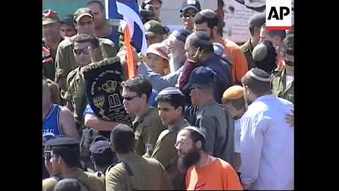 WRAP Settlers leaving with Torah scrolls