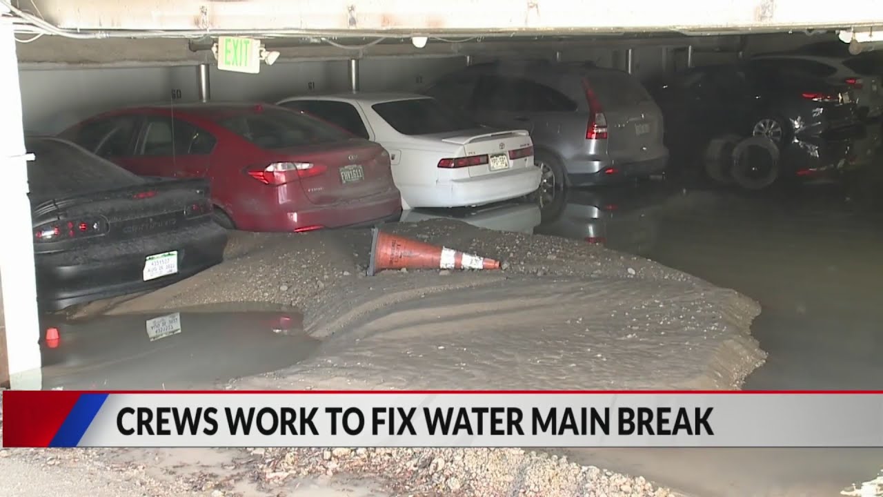 Water main burst floods parking garage - YouTube