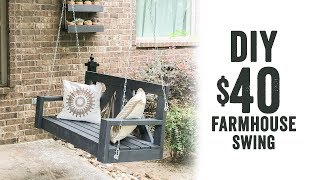 We designed a super cute DIY Farmhouse Porch Swing for under $30 in lumber! This is a simple design, and would be cute 