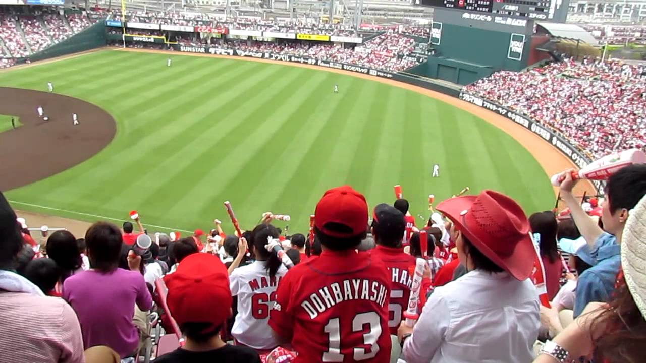 Hiroshima Carp fans cheer on their team. Wonderful team spirit!