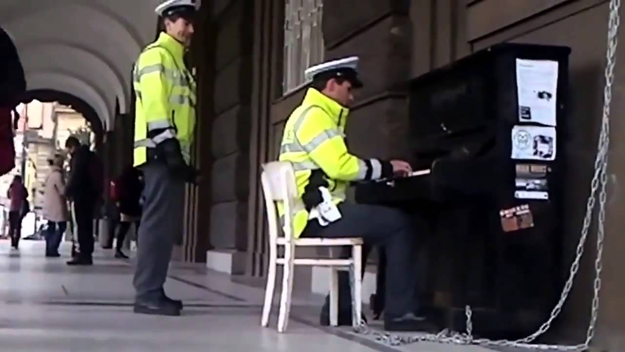 Police officer plays piano - YouTube