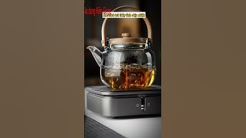 ấm pha trà thủy tinh có quai xách và nắp gỗ, lõi lọc trà  Ấm chịu nhiệt nấu được trên bếp điện và bế