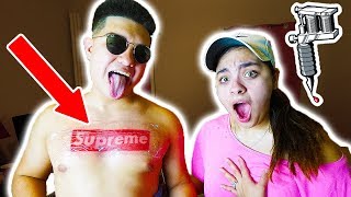 We got the supreme box logo tattoo on our chest!! my wife flipped!!
you won't believe her reaction to this hypebeast prank!! more daily
episodes here https:/...