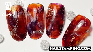 Red, marble nail art effected with nail foil (nailstamping.com)