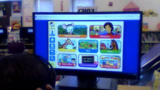 Austin learns all about the ABC Mouse website on the computers at the library.