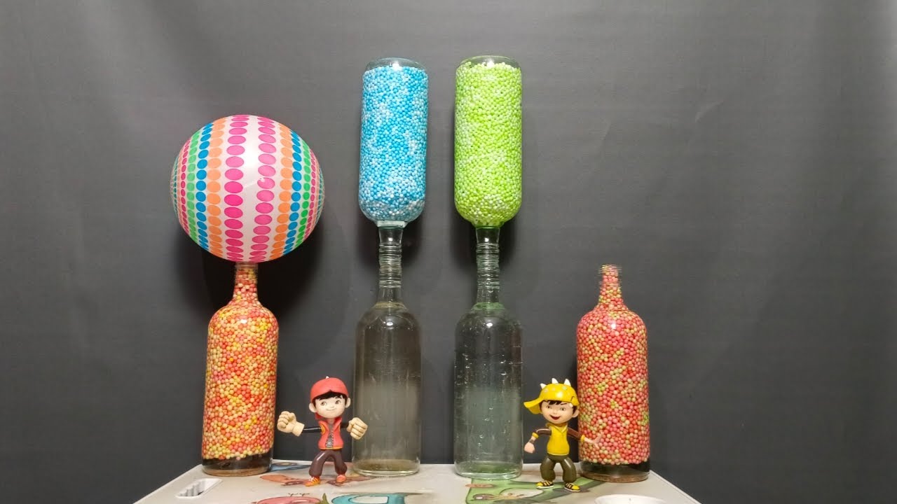 Satisfying video ASMR Styrofoam balls two bottle blue and green