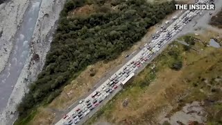 Tens of thousands flee Russia to avoid military draft