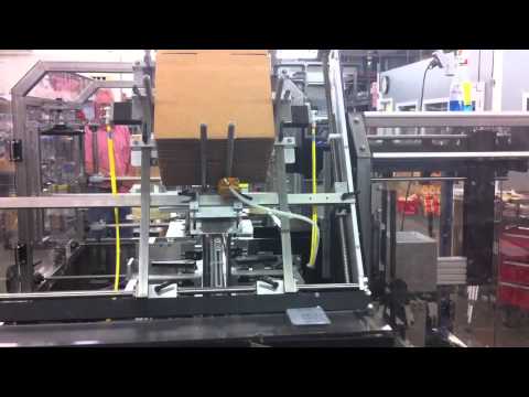 Econocorp Econocaser Tape Application with Upstacking unit - YouTube