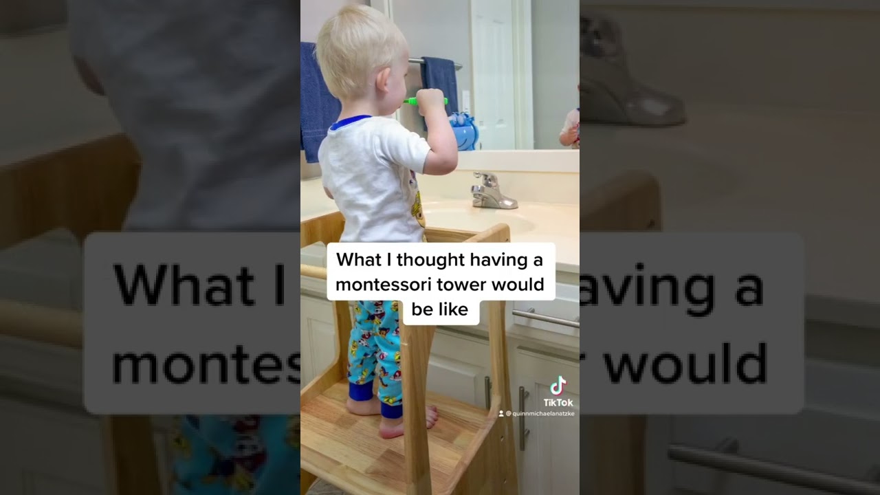 Toddler uses learning tower to climb onto kitchen counter