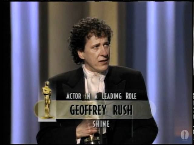 Geoffrey Rush winning Best Actor class=