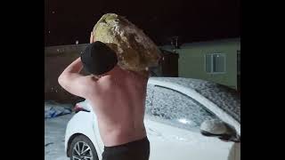 99kg (218lbs) frozen stone to shoulder and carry in -3 degrees. Scottish stone lifting.