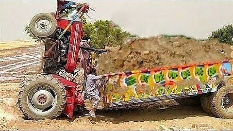 Tractor accident caused great damage to the tractor while taking mud loaded Trolley