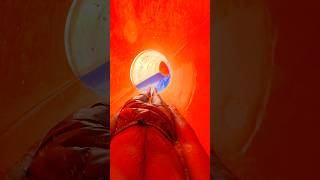 POV speedsliding inside tunnel waterslide