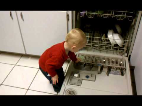 Toren putting detergent in dishwasher