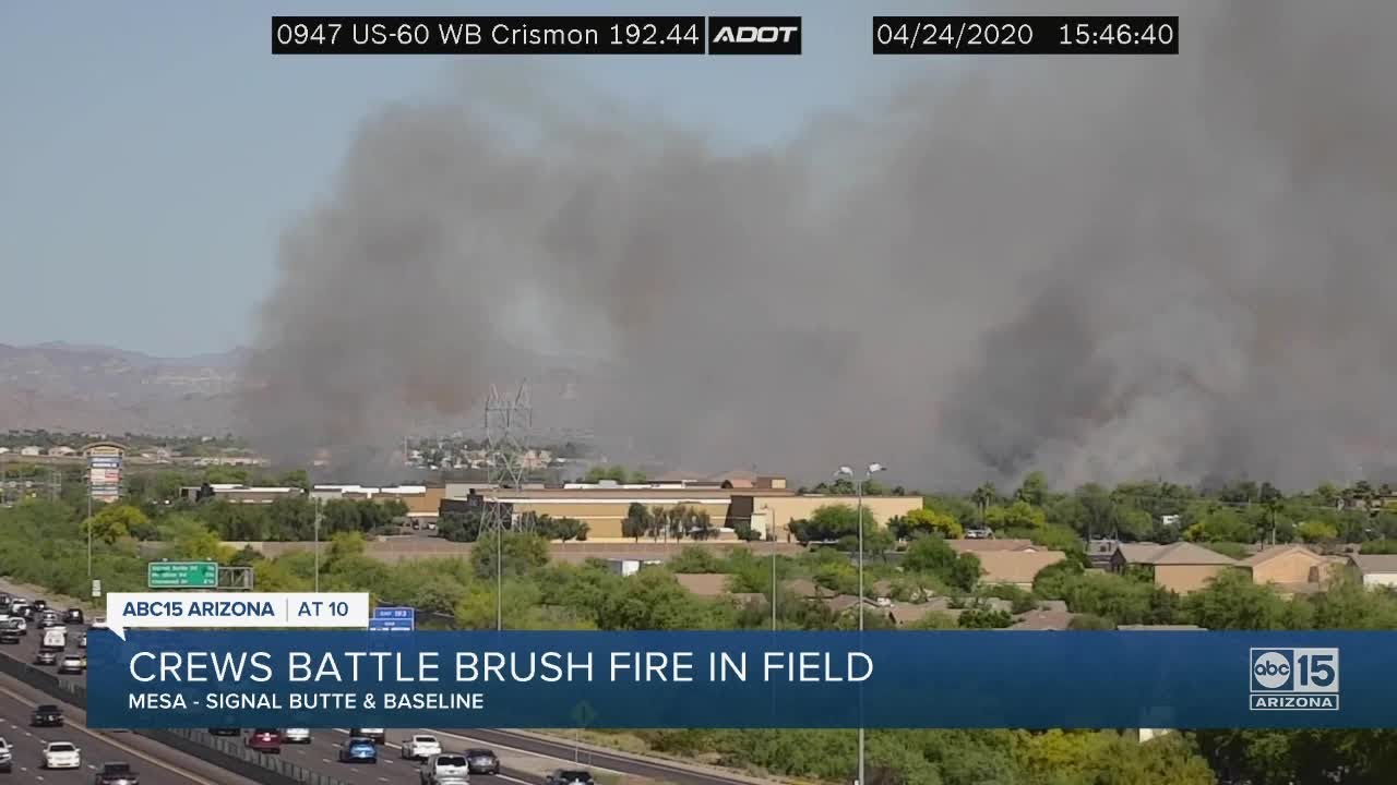 Crews battle brush fire in field - YouTube