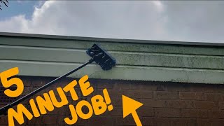 Demonstration on cleaning green Grimy Cladding in the rain