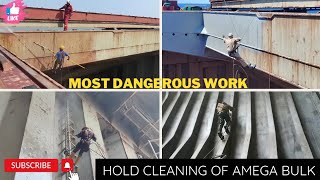 dangerous operation preparation of hold for loading grane  hold cleaning of a mega bulk