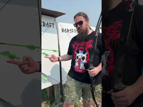 Slow Motion Focus The Arrow Flies Bullseye And The Archer Stands Proud Beside The Bullseye 