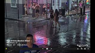 dancing in the rain on Bourbon Street Saturday night