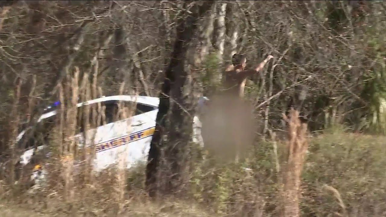 Naked man driving stolen JSO cruiser crashes into woods on I-10 - YouTube