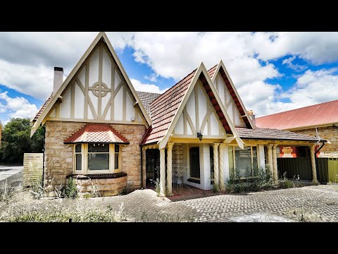 Beautiful Tudor home that became a business and then replaced by a liquor store. Built 1928.