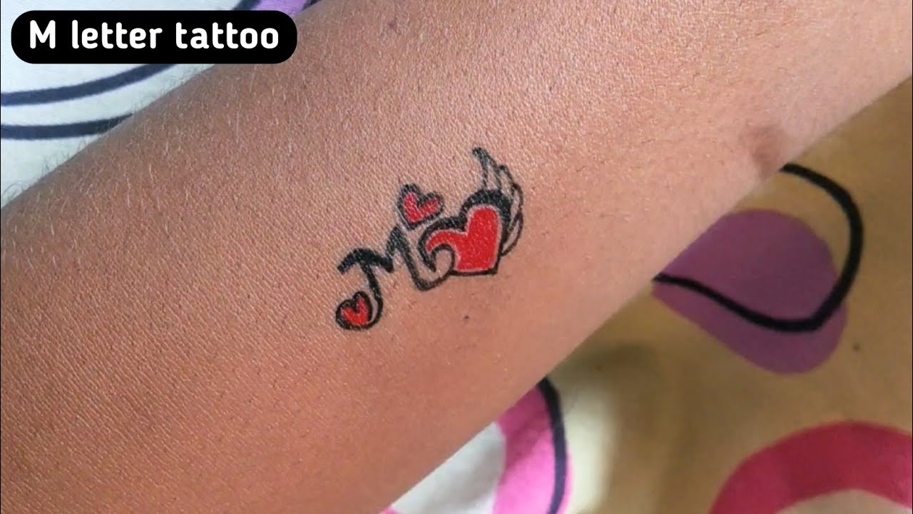 Tattoo of MMS heart Love tattoo  custom tattoo designs on  TattooTribescom